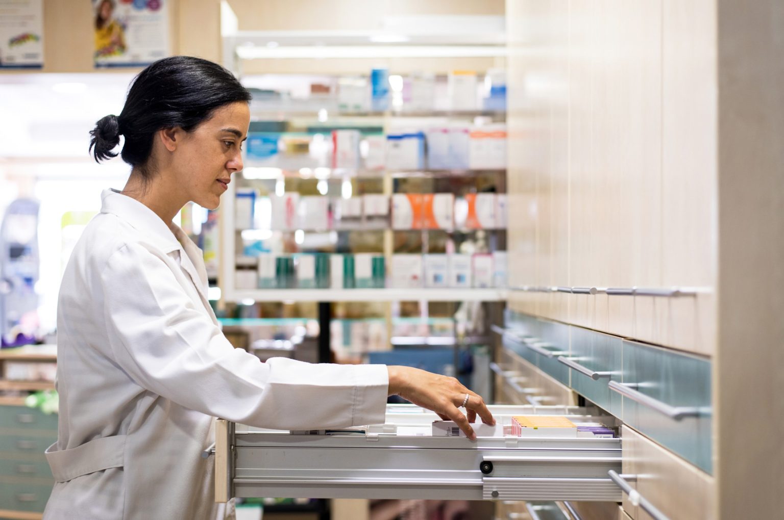 Pharmacist looking for prescription medication